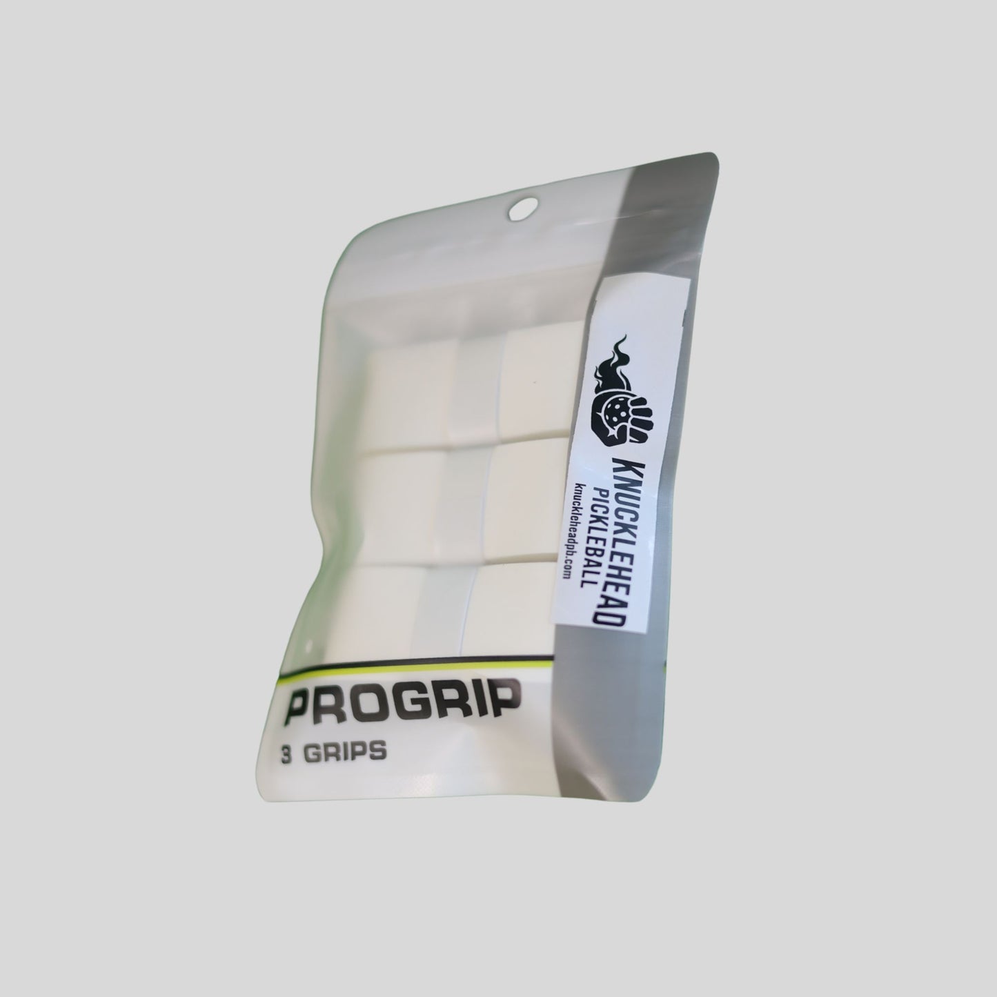 A package of three white pickleball grips by ProGrip, branded with a black logo and text on a light gray background.