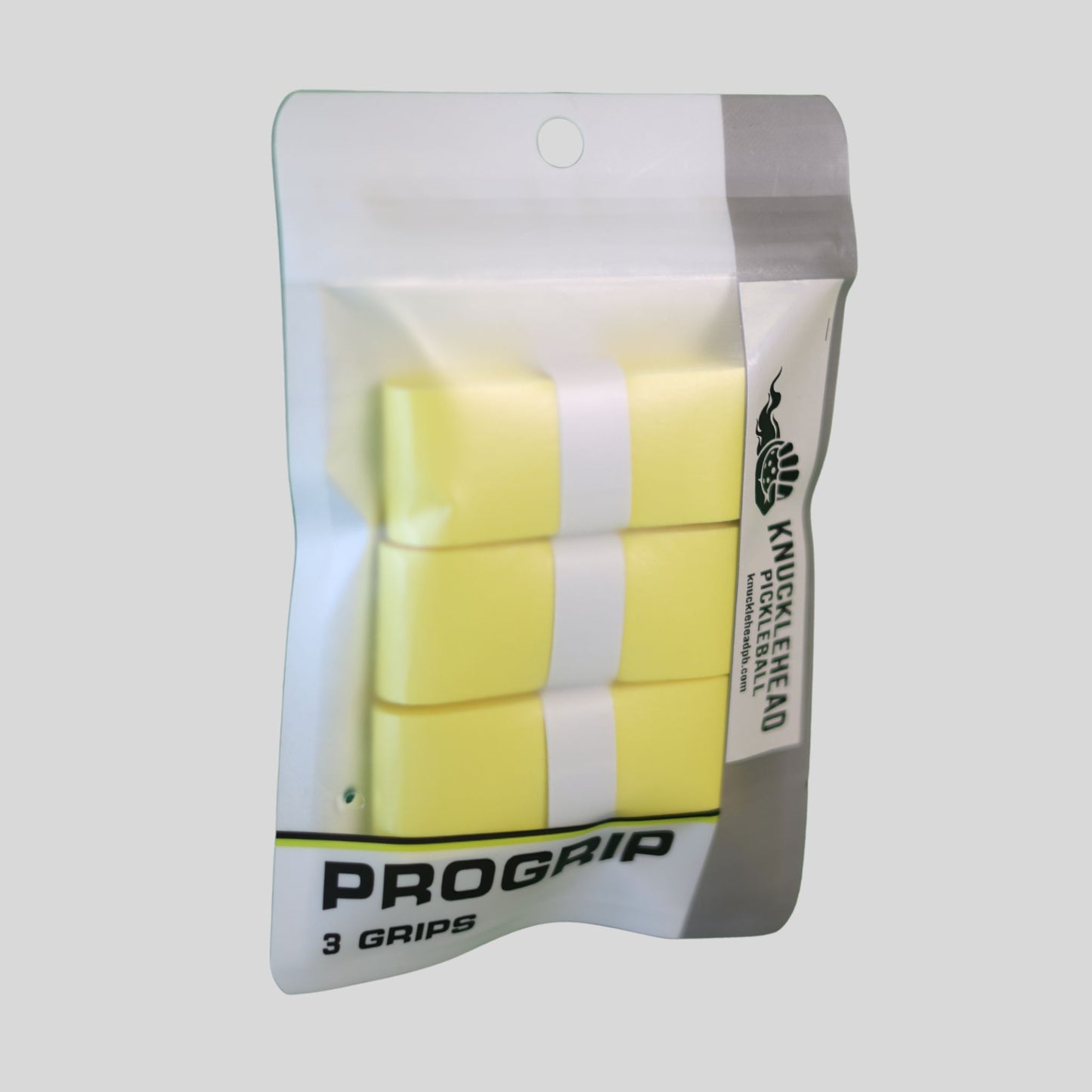 A package of three yellow ProGrip knuckle wraps in a clear hanging pouch with a white and gray backing, shown on a light gray background.