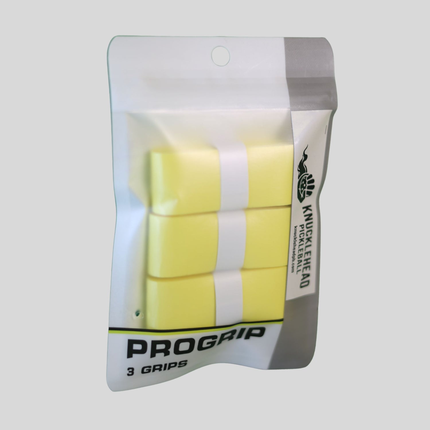 A package of three yellow ProGrip knuckle wraps in a clear hanging pouch with a white and gray backing, shown on a light gray background.